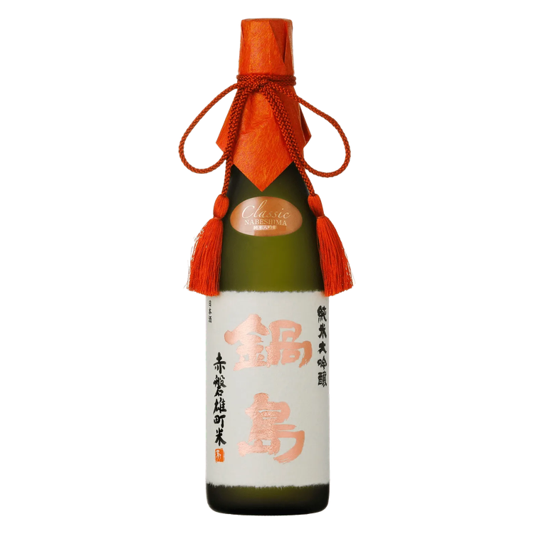 A bottle of Japanese sake with a dark green glass body, a white label with orange and black text, an orange paper neck wrap tied with a cord, and orange tassels, shown on a plain white background.