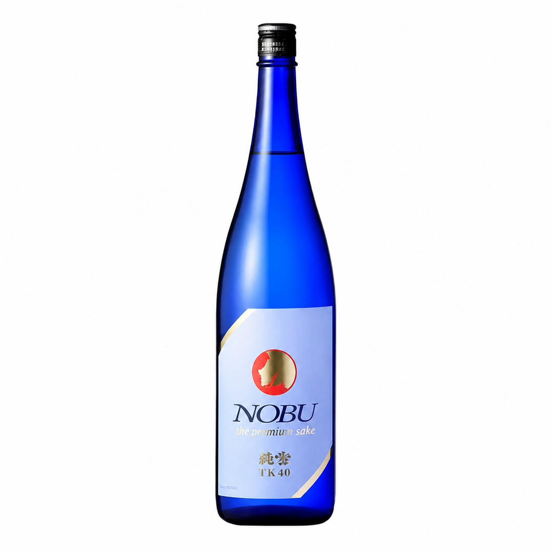 A single tall blue glass bottle of Nobu The Premium Sake on a plain white background. The bottle has a black screw cap and a white label with gold and red details, including the Nobu brand name.